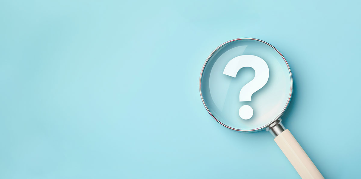 magnifying glass over question mark